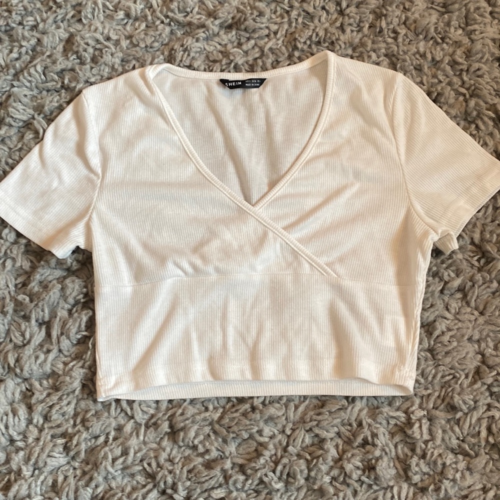 white crop top, tight fitting, crossover neckline
